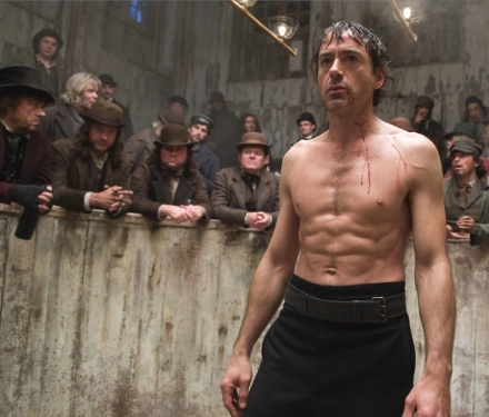 Sherlock Holmes he's still pale and pasty, but sherlock 2.0 boxes, parkours, and takes his shirt off.